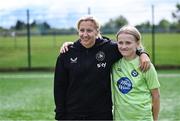 16 July 2025; Republic of Ireland WNT head coach Carla Ward with Vakare Martinaviciute on a visit to the MiWadi FAI Football Camp at Leixlip United in Collinstown, Kildare. Photo by Piaras Ó Mídheach/Sportsfile