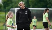16 July 2025; Republic of Ireland WNT head coach Carla Ward with Elsie Kelly as she visits the MiWadi FAI Football Camp at Leixlip United in Collinstown, Kildare. Photo by Piaras Ó Mídheach/Sportsfile