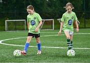 16 July 2025; Amy Mooney, left, and Maggie Homan during the MiWadi FAI Football Camp at Leixlip United in Collinstown, Kildare. Photo by Piaras Ó Mídheach/Sportsfile