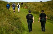 16 July 2025; Members of the PSNI patrol the course during a practice round at Royal Portrush Golf Club in Portrush, Antrim, ahead of The 153rd Open Championship. Photo by Ramsey Cardy/Sportsfile