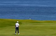 16 July 2025; Rory McIlroy of Northern Ireland walks onto a green during a practice round at Royal Portrush Golf Club in Portrush, Antrim, ahead of The 153rd Open Championship. Photo by Ramsey Cardy/Sportsfile
