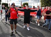16 July 2025; Shelbourne supporters arrive before the UEFA Champions League First Qualifying Round second leg match between Linfield and Shelbourne at Clearer Twist National Football Stadium at Windsor Park in Belfast. Photo by Ben McShane/Sportsfile