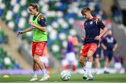 16 July 2025; James Norris, right, and Harry Wood of Shelbourne warms up before the UEFA Champions League First Qualifying Round second leg match between Linfield and Shelbourne at Clearer Twist National Football Stadium at Windsor Park in Belfast. Photo by Stephen McCarthy/Sportsfile