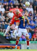 16 July 2025; Mark Coyle of Shelbourne in action against Matthew Fitzpatrick of Linfield during the UEFA Champions League First Qualifying Round second leg match between Linfield and Shelbourne at Clearer Twist National Football Stadium at Windsor Park in Belfast. Photo by Stephen McCarthy/Sportsfile