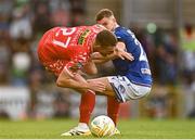 16 July 2025; Evan Caffrey of Shelbourne is tackled by Ethan McGee of Linfield during the UEFA Champions League First Qualifying Round second leg match between Linfield and Shelbourne at Clearer Twist National Football Stadium at Windsor Park in Belfast. Photo by Ben McShane/Sportsfile