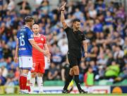 16 July 2025; Referee Andrew Madley shows a red card to Ben Hall of Linfield during the UEFA Champions League First Qualifying Round second leg match between Linfield and Shelbourne at Clearer Twist National Football Stadium at Windsor Park in Belfast. Photo by Stephen McCarthy/Sportsfile