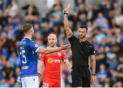 16 July 2025; Referee Andrew Madley shows a red card to Ben Hall of Linfield during the UEFA Champions League First Qualifying Round second leg match between Linfield and Shelbourne at Clearer Twist National Football Stadium at Windsor Park in Belfast. Photo by Stephen McCarthy/Sportsfile