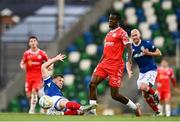 16 July 2025; Ben Hall of Linfield tackles Mipo Odubeko of Shelbourne, resulting in a red card, during the UEFA Champions League First Qualifying Round second leg match between Linfield and Shelbourne at Clearer Twist National Football Stadium at Windsor Park in Belfast. Photo by Ben McShane/Sportsfile