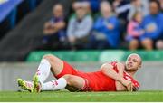 16 July 2025; Kerr McInroy of Shelbourne goes down with an injury during the UEFA Champions League First Qualifying Round second leg match between Linfield and Shelbourne at Clearer Twist National Football Stadium at Windsor Park in Belfast. Photo by Stephen McCarthy/Sportsfile