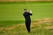 17 July 2025; Julien Guerrier of France watches his tee shot on the second hole during day one of The 153rd Open Championship at Royal Portrush Golf Club in Portrush, Antrim. Photo by David Fitzgerald/Sportsfile