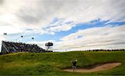 17 July 2025; Cameron Young of USA plays out of a bunker on the first hole during day one of The 153rd Open Championship at Royal Portrush Golf Club in Portrush, Antrim. Photo by Ramsey Cardy/Sportsfile