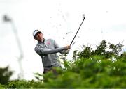 17 July 2025; Tom McKibbin of Northern Ireland plays his shot from the rough on the 11th hole during day one of The 153rd Open Championship at Royal Portrush Golf Club in Portrush, Antrim. Photo by Ramsey Cardy/Sportsfile