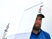17 July 2025; Shane Lowry of Ireland uses an umbrella to shelter from the rain during day one of The 153rd Open Championship at Royal Portrush Golf Club in Portrush, Antrim. Photo by David Fitzgerald/Sportsfile