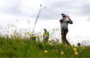 17 July 2025; Scottie Scheffler of USA watches his shot from the rough on the second hole during day one of The 153rd Open Championship at Royal Portrush Golf Club in Portrush, Antrim. Photo by David Fitzgerald/Sportsfile