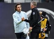 17 July 2025; Jacob Skov Olesen of Denmark shakes hands with Taylor Pendrith of Canada on the 18th green during day one of The 153rd Open Championship at Royal Portrush Golf Club in Portrush, Antrim. Photo by Ramsey Cardy/Sportsfile