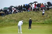 17 July 2025; Spectators look on in the rain during day one of The 153rd Open Championship at Royal Portrush Golf Club in Portrush, Antrim. Photo by David Fitzgerald/Sportsfile
