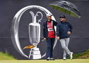 17 July 2025; Jordan Smith of England and his caddie Sam Matton on the 18th green during day one of The 153rd Open Championship at Royal Portrush Golf Club in Portrush, Antrim. Photo by Ramsey Cardy/Sportsfile