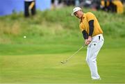 17 July 2025; Haotong Li of China chips onto the 18th green during day one of The 153rd Open Championship at Royal Portrush Golf Club in Portrush, Antrim. Photo by Ramsey Cardy/Sportsfile