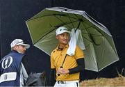 17 July 2025; Haotong Li of China after completing his round during day one of The 153rd Open Championship at Royal Portrush Golf Club in Portrush, Antrim. Photo by Ramsey Cardy/Sportsfile