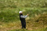 17 July 2025; Jon Rahm of Spain watches his shot from the rough on the eighth hole during day one of The 153rd Open Championship at Royal Portrush Golf Club in Portrush, Antrim. Photo by David Fitzgerald/Sportsfile
