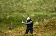 17 July 2025; Jon Rahm of Spain plays a shot from the rough on the eighth hole during day one of The 153rd Open Championship at Royal Portrush Golf Club in Portrush, Antrim. Photo by David Fitzgerald/Sportsfile