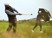 17 July 2025; Scottie Scheffler of USA plays a shot from the rough on the ninth hole during day one of The 153rd Open Championship at Royal Portrush Golf Club in Portrush, Antrim. Photo by David Fitzgerald/Sportsfile