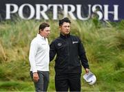 17 July 2025; Matt Fitzpatrick of England and Hideki Matsuyama of Japan after finishing their round on the 18th green during day one of The 153rd Open Championship at Royal Portrush Golf Club in Portrush, Antrim. Photo by David Fitzgerald/Sportsfile