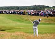 17 July 2025; Rory McIlroy of Northern Ireland plays a shot from the rough on the first hole during day one of The 153rd Open Championship at Royal Portrush Golf Club in Portrush, Antrim. Photo by Ramsey Cardy/Sportsfile