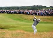 17 July 2025; Rory McIlroy of Northern Ireland plays a shot from the rough on the first hole during day one of The 153rd Open Championship at Royal Portrush Golf Club in Portrush, Antrim. Photo by Ramsey Cardy/Sportsfile