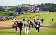 17 July 2025; Rory McIlroy of Northern Ireland walks down the first fairway during day one of The 153rd Open Championship at Royal Portrush Golf Club in Portrush, Antrim. Photo by Ramsey Cardy/Sportsfile