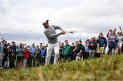 17 July 2025; Rory McIlroy of Northern Ireland plays a shot from the rough on the second hole during day one of The 153rd Open Championship at Royal Portrush Golf Club in Portrush, Antrim. Photo by Ramsey Cardy/Sportsfile