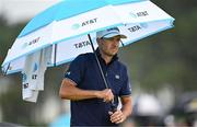 17 July 2025; Jordan Spieth of USA uses an umbrella to shelter from the rain during day one of The 153rd Open Championship at Royal Portrush Golf Club in Portrush, Antrim. Photo by David Fitzgerald/Sportsfile