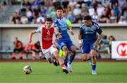 17 July 2025; Kian Leavy of St Patrick's Athletic in action against Nikola Doric, right, and Lazar Kojic of FC Hegelmann during the UEFA Conference League First Qualifying Round second leg match between FC Hegelmann and St Patrick's Athletic at Raudondvaris Stadium in Raudondvaris, Lithuania. Photo by Evaldas Semiotas/Sportsfile