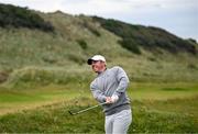 17 July 2025; Rory McIlroy of Northern Ireland watches his from from the rough on the seventh hole during day one of The 153rd Open Championship at Royal Portrush Golf Club in Portrush, Antrim. Photo by Ramsey Cardy/Sportsfile