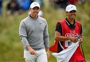 17 July 2025; Rory McIlroy of Northern Ireland with his caddie Harry Diamond after a putt on the seventh green during day one of The 153rd Open Championship at Royal Portrush Golf Club in Portrush, Antrim. Photo by Ramsey Cardy/Sportsfile