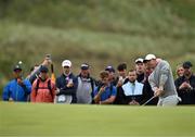17 July 2025; Rory McIlroy of Northern Ireland chips onto the 15th green during day one of The 153rd Open Championship at Royal Portrush Golf Club in Portrush, Antrim. Photo by Ramsey Cardy/Sportsfile