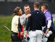 17 July 2025; Rory McIlroy of Northern Ireland and Justin Thomas of USA embrace after finishing their round during day one of The 153rd Open Championship at Royal Portrush Golf Club in Portrush, Antrim. Photo by Ramsey Cardy/Sportsfile