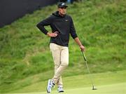 17 July 2025; Tony Finau of USA waits on the 18th green during day one of The 153rd Open Championship at Royal Portrush Golf Club in Portrush, Antrim. Photo by Ramsey Cardy/Sportsfile