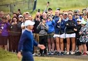 18 July 2025; Supporters look on as Rory McIlroy of Northern Ireland walks down the first fairway during day two of The 153rd Open Championship at Royal Portrush Golf Club in Portrush, Antrim. Photo by Ramsey Cardy/Sportsfile