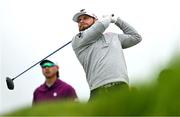 18 July 2025; Tyrrell Hatton of England watches his tee shot on the second hole during day two of The 153rd Open Championship at Royal Portrush Golf Club in Portrush, Antrim. Photo by Ramsey Cardy/Sportsfile