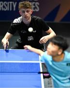 18 July 2025; Ben Watson, from Dundonald in Down, representing Queen's University Belfast and Ireland, competes in round 3 of the men's team competition against Chan Ci of Team Macau during day two of the FISU World University Games 2025 at Messe Essen Halle in Essen, Germany. Photo by Shauna Clinton/Sportsfile