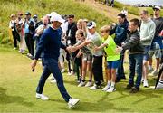 18 July 2025; Rory McIlroy of Northern Ireland high fives supporters during day two of The 153rd Open Championship at Royal Portrush Golf Club in Portrush, Antrim. Photo by David Fitzgerald/Sportsfile