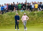 18 July 2025; Rory McIlroy of Northern Ireland and Justin Thomas of USA on the seventh green during day two of The 153rd Open Championship at Royal Portrush Golf Club in Portrush, Antrim. Photo by David Fitzgerald/Sportsfile
