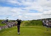 18 July 2025; Tommy Fleetwood of England watches his tee shot on the 14th hole during day two of The 153rd Open Championship at Royal Portrush Golf Club in Portrush, Antrim. Photo by David Fitzgerald/Sportsfile