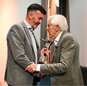18 July 2025; Former Tipperary hurler Eddie O'Donnell, right, is presented with the GPA Croí Bhríde Award by GPA president Dónal Óg Cusack during the GPA Hurling and Camogie Legends Lunch at Croke Park in Dublin. Photo by Seb Daly/Sportsfile