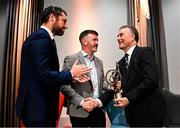 18 July 2025; Former Galway hurler Joe Connolly, right, is presented with his GPA Lifetime Achievement Award by GPA president Dónal Óg Cusack, centre, and GPA chief executive officer Tom Parsons during the GPA Hurling and Camogie Legends Lunch at Croke Park in Dublin. Photo by Seb Daly/Sportsfile