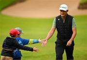 18 July 2025; Haotong Li of China with supporters during day two of The 153rd Open Championship at Royal Portrush Golf Club in Portrush, Antrim. Photo by David Fitzgerald/Sportsfile