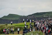 18 July 2025; Scottie Scheffler of USA watches his tee shot on the seventh hole during day two of The 153rd Open Championship at Royal Portrush Golf Club in Portrush, Antrim. Photo by Ramsey Cardy/Sportsfile