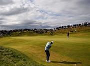 18 July 2025; Collin Morikawa of USA chips onto the seventh green during day two of The 153rd Open Championship at Royal Portrush Golf Club in Portrush, Antrim. Photo by Ramsey Cardy/Sportsfile