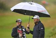 18 July 2025; Shane Lowry of Ireland with his caddie Darren Reynolds during day two of The 153rd Open Championship at Royal Portrush Golf Club in Portrush, Antrim. Photo by Ramsey Cardy/Sportsfile